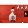 PERSONAGGIO NATALIZIO SEDUTO CON LUCE SOGGETTI ASSORTITI